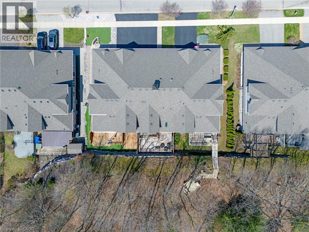 Aerial perspective showcasing a property with a grey shingle roof, a paved driveway, and multiple rear decks - 227 Chestnut Hill Crescent, Kitchener, ON -
