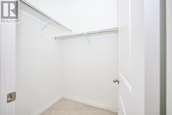 Walk-in closet in primary suite -