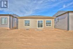 Rear view of the property and lot -