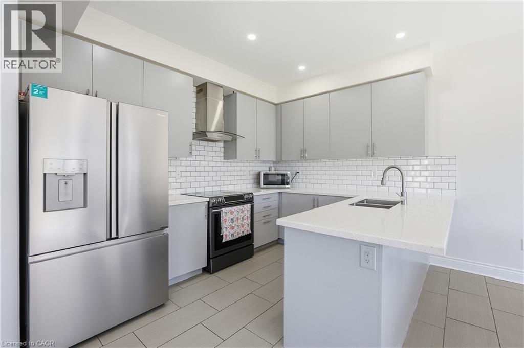 57 Thompson Road, Caledonia, ON - Indoor Photo Showing Kitchen With Double Sink With Upgraded Kitchen