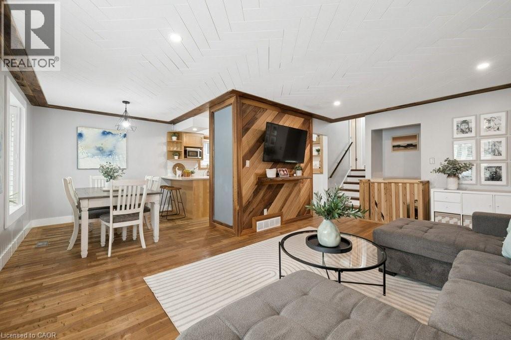 Open-concept living space with wood-finish flooring - 522 Glendene Crescent, Waterloo, ON - Indoor Photo Showing Other Room