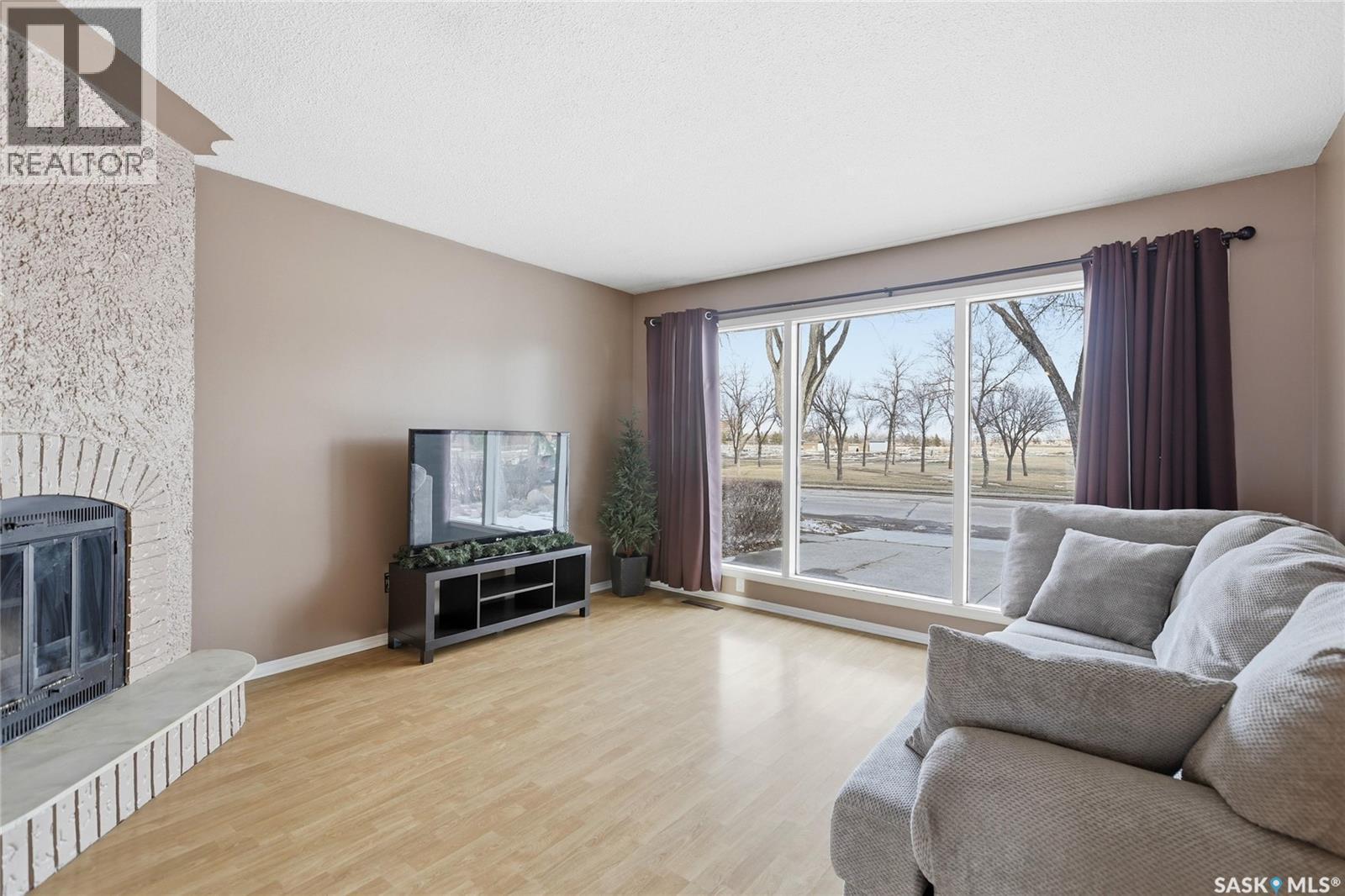 3312 Grant Road, Regina, SK - Indoor Photo Showing Living Room With Fireplace
