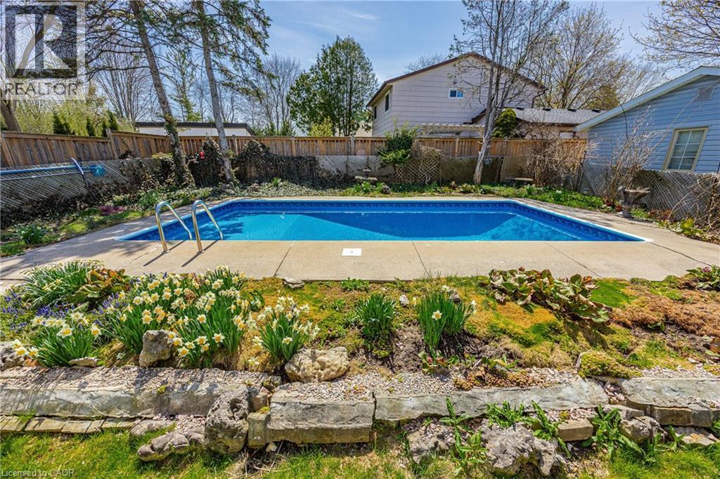 Rectangular in-ground pool with concrete surround - 277 Blackacres Boulevard, London, ON - Outdoor With In Ground Pool With Backyard