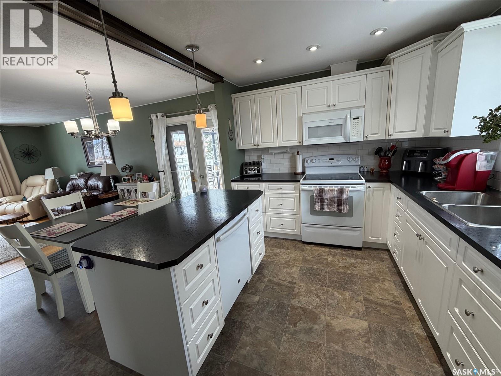 739 Hudson Crescent, Hudson Bay, SK - Indoor Photo Showing Kitchen With Double Sink