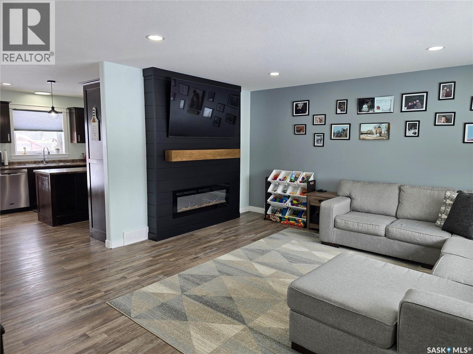 12 Scott Bay, Muenster, SK - Indoor Photo Showing Living Room With Fireplace
