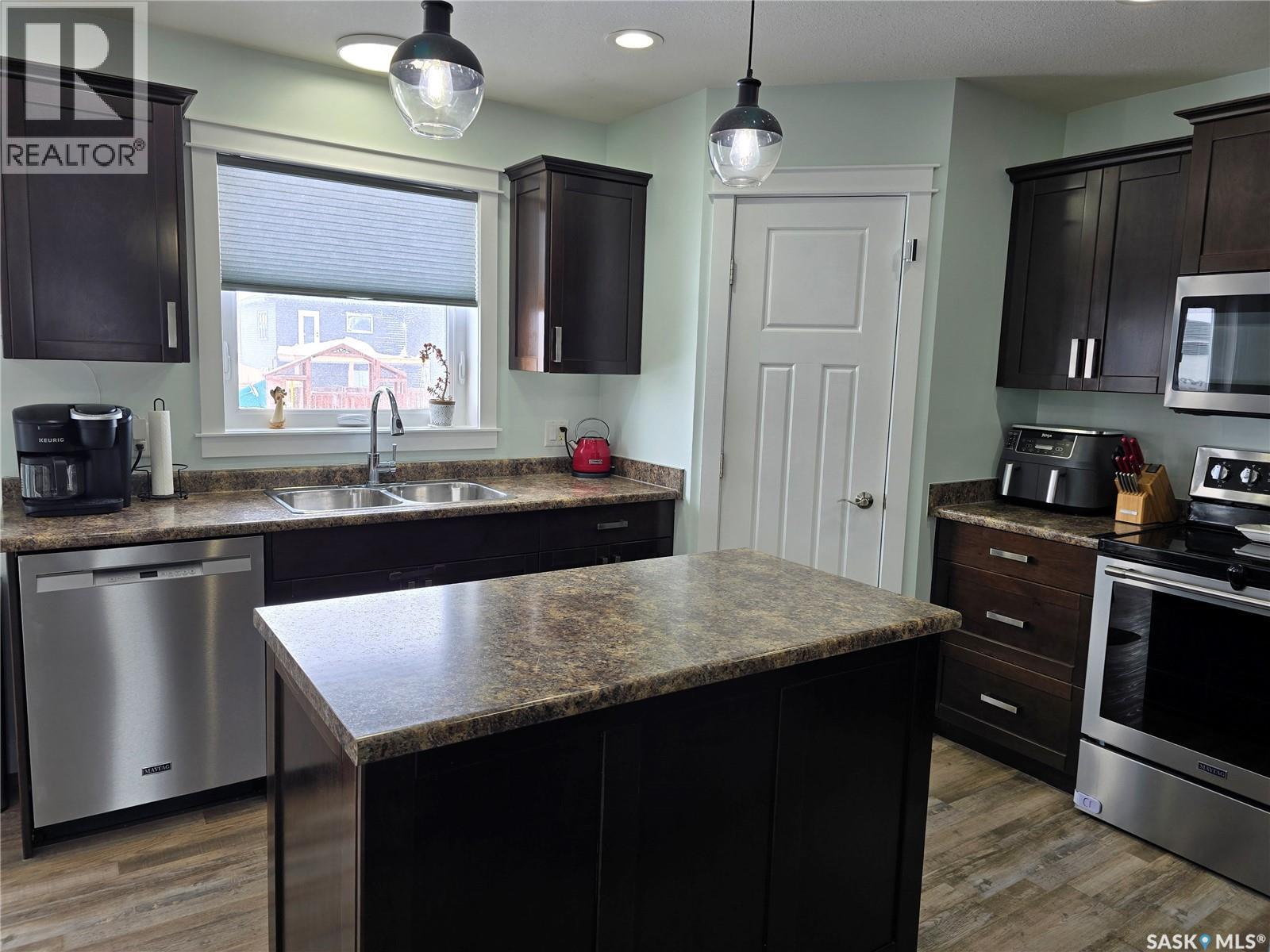 12 Scott Bay, Muenster, SK - Indoor Photo Showing Kitchen With Stainless Steel Kitchen With Double Sink