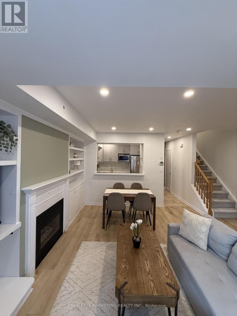 123 - 3 Everson Drive, Toronto, ON - Indoor Photo Showing Other Room With Fireplace