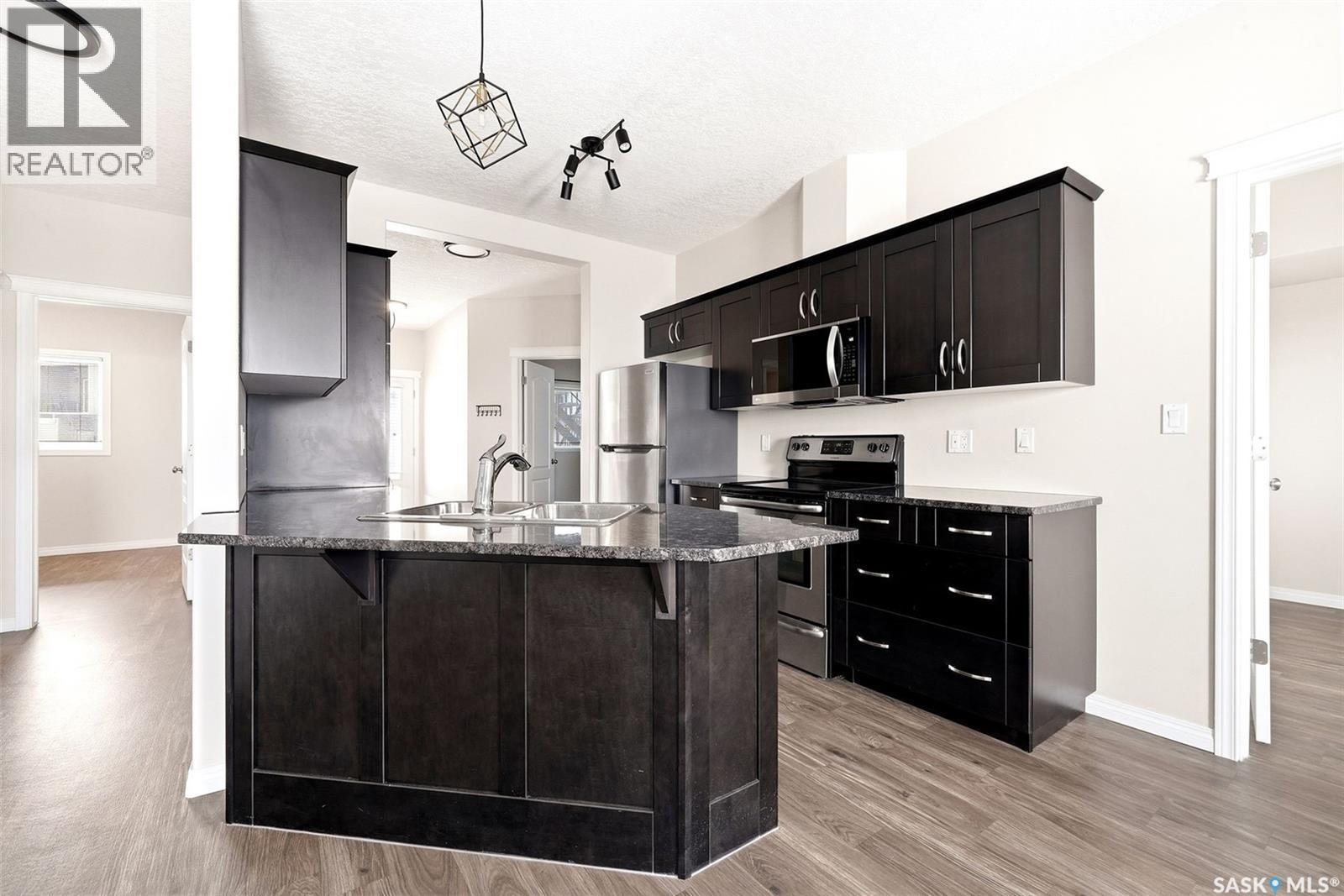 401 3826 Dewdney Avenue E, Regina, SK - Indoor Photo Showing Kitchen With Upgraded Kitchen