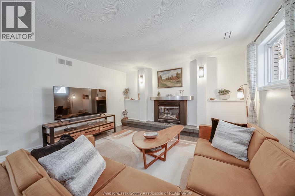 109 Centennial, Tecumseh, ON - Indoor Photo Showing Living Room With Fireplace