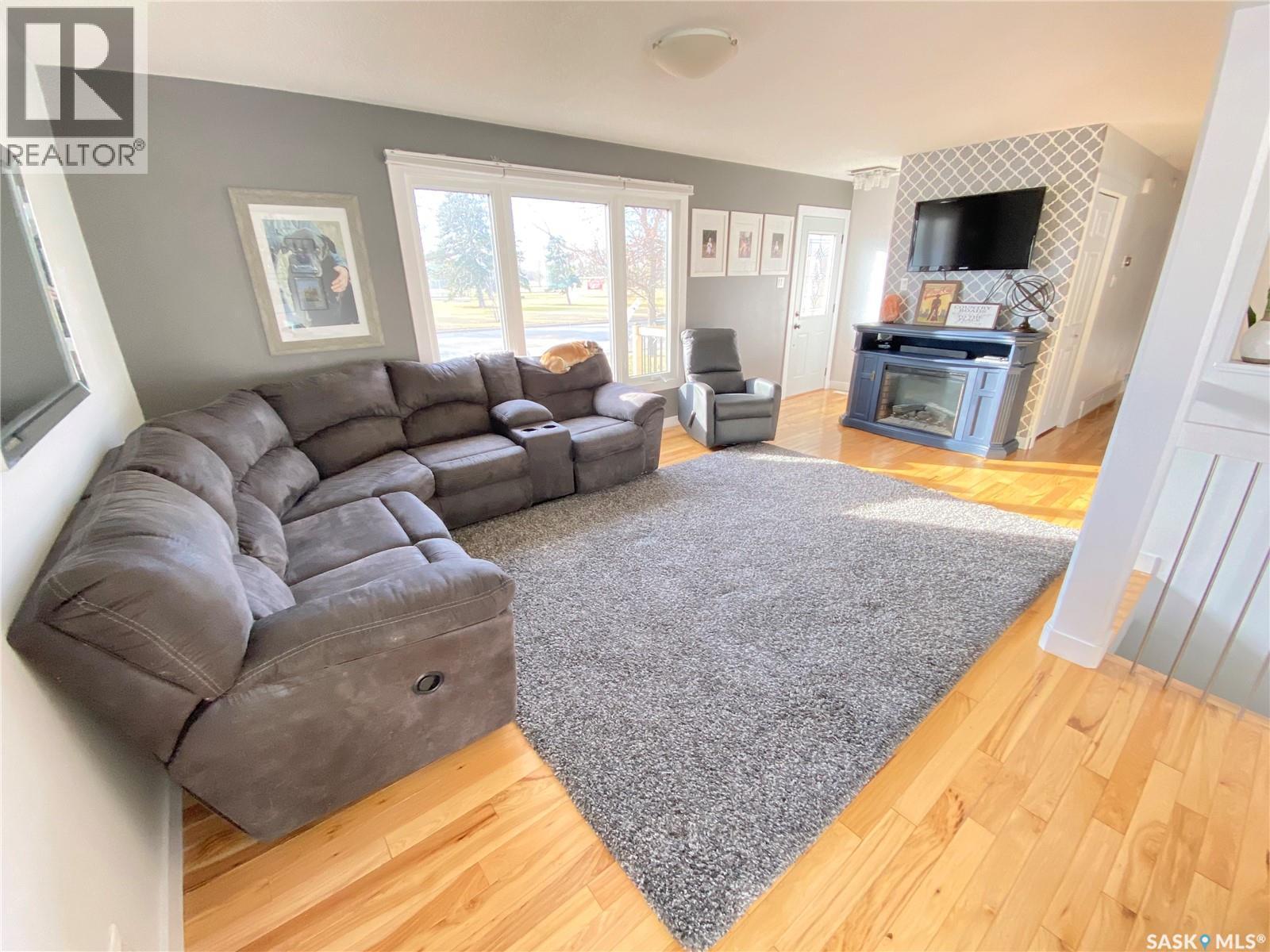 1205 Douglas Road, Weyburn, SK - Indoor Photo Showing Living Room With Fireplace