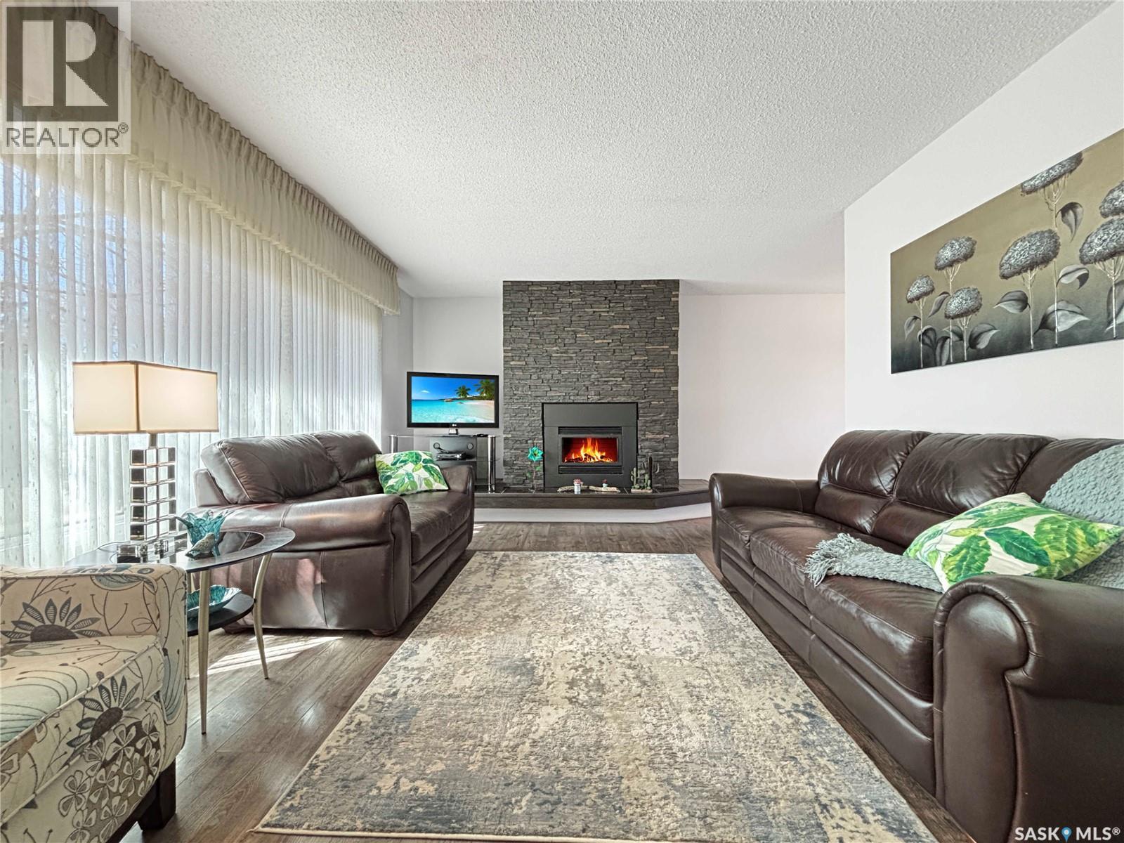 755 Tobin Terrace, Saskatoon, SK - Indoor Photo Showing Living Room With Fireplace