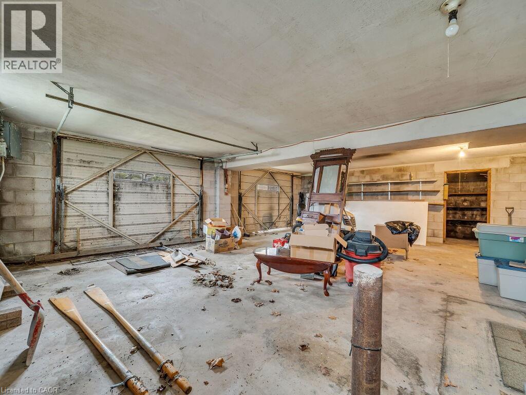 Spacious unfinished interior featuring concrete flooring and block wall construction - 1416 Highway 6, Hamilton, ON - Indoor Photo Showing Garage