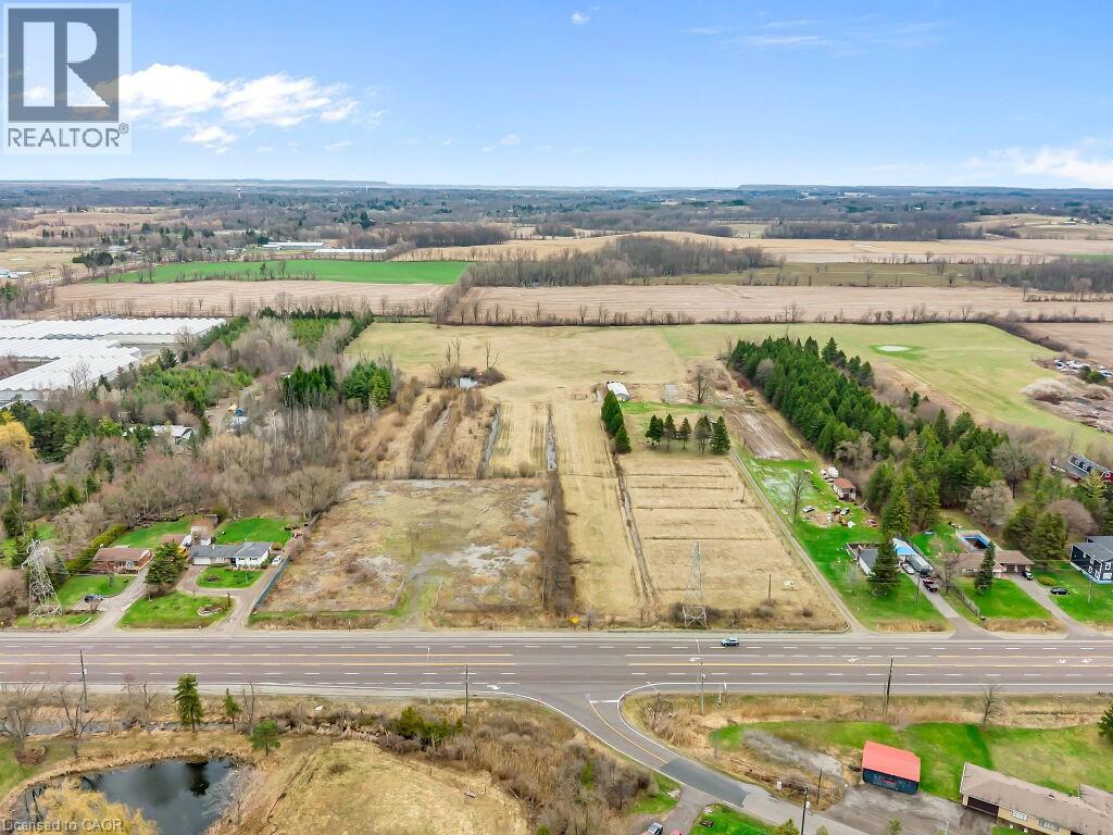 Expansive land parcel featuring direct road frontage, multiple distinct fields, and mature tree lines - 1416 Highway 6, Hamilton, ON - Outdoor With View