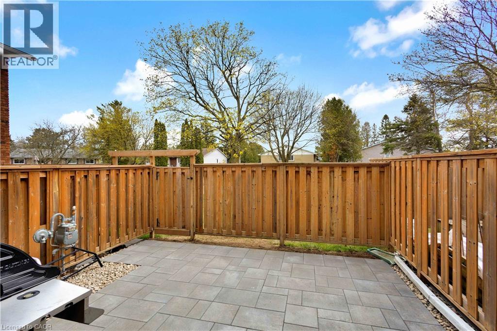 Paved patio area featuring large format pavers - 32 Montclair Crescent, Simcoe, ON - Outdoor