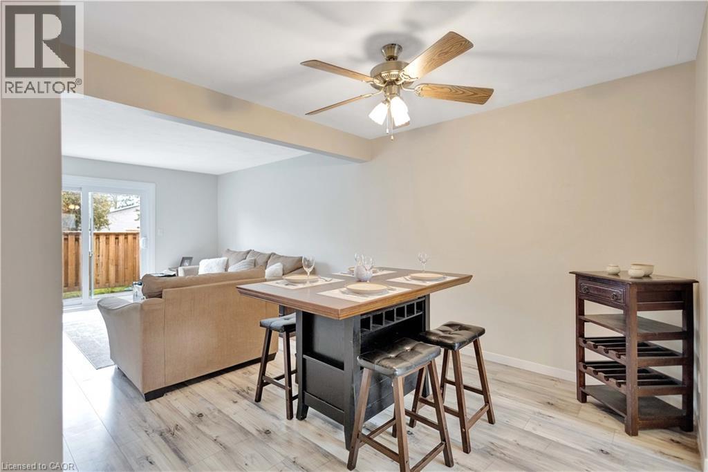 Dining area featuring wood-finish flooring and a ceiling fan - 32 Montclair Crescent, Simcoe, ON - Indoor