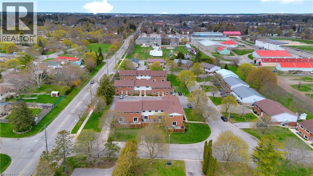 Aerial perspective highlighting a residential community with multi-unit dwellings - 32 Montclair Crescent, Simcoe, ON - Outdoor With View