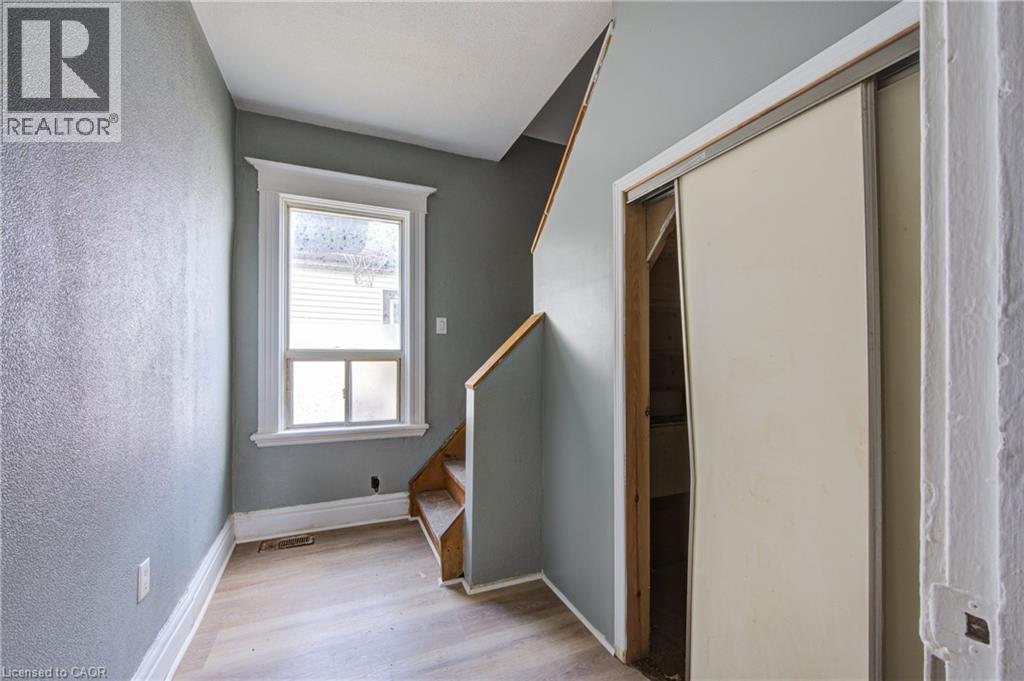 First set of Stairs to upper level and storage below stairs - 1 Rathgar Street, London, ON - Indoor Photo Showing Other Room