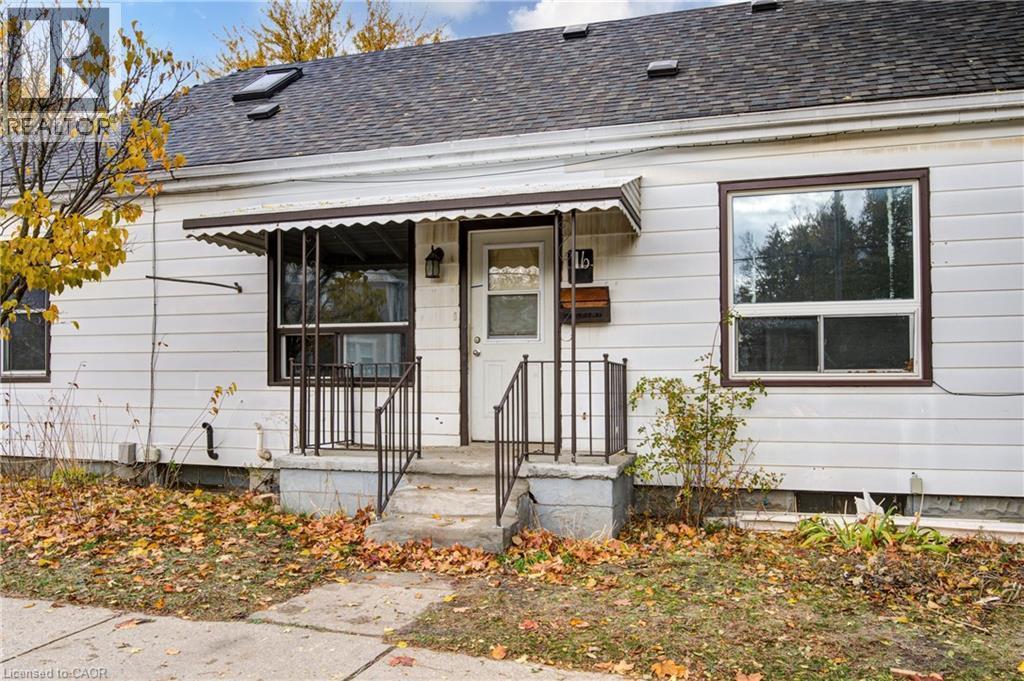 Unit 1B entrance; White siding exterior with dark brown trim windows - 1 Rathgar Street, London, ON - Outdoor