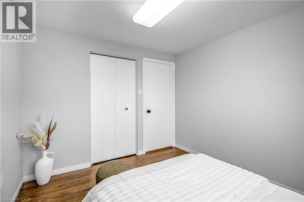 Light gray walls with wood-finish flooring - 85 Ranchdale Drive, Hamilton, ON