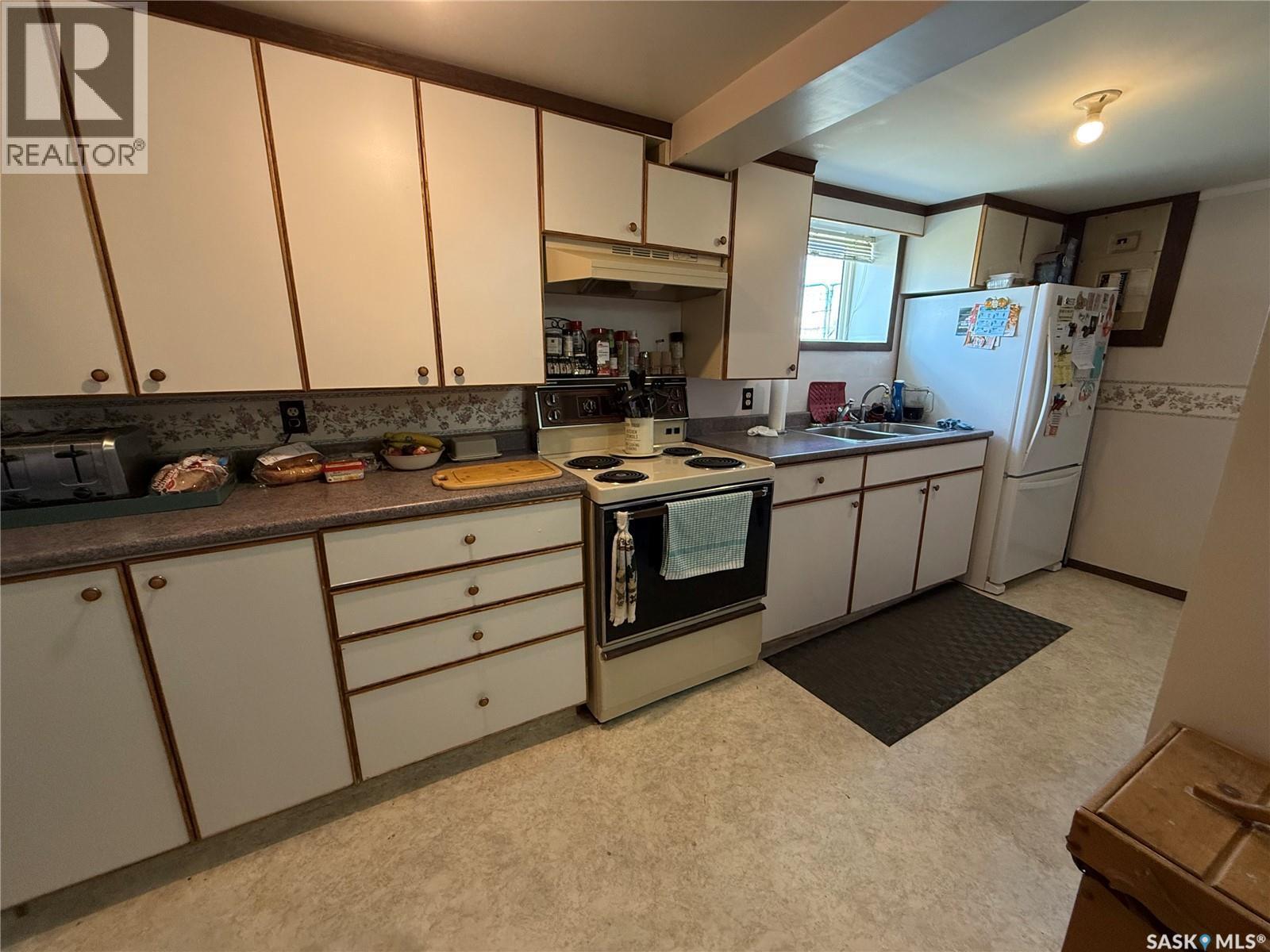 737 Third Street, Estevan, SK - Indoor Photo Showing Kitchen With Double Sink