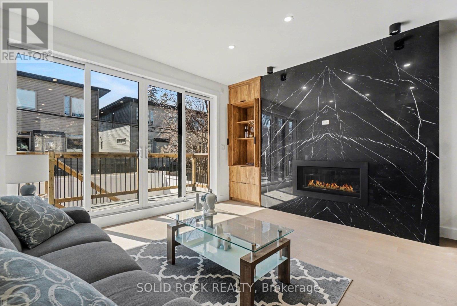 826 Alpine Avenue, Ottawa, ON - Indoor Photo Showing Living Room With Fireplace