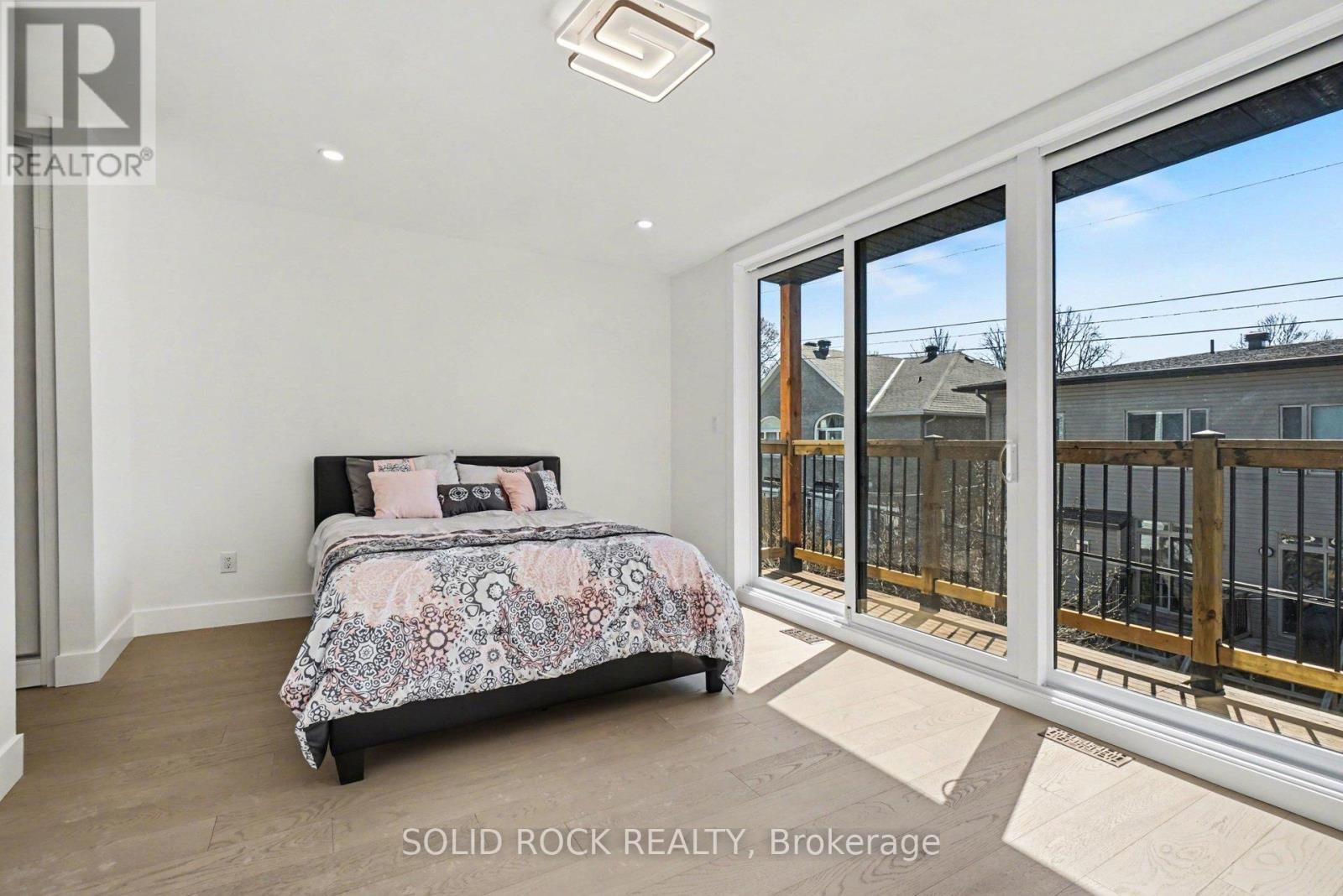 With private balcony - 826 Alpine Avenue, Ottawa, ON - Photo Showing Bedroom