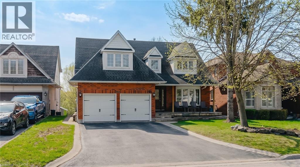 Brick-faced exterior with white trim accents and dark shingle roof - 79 Holbrook Crescent, Cambridge, ON - Outdoor With Facade