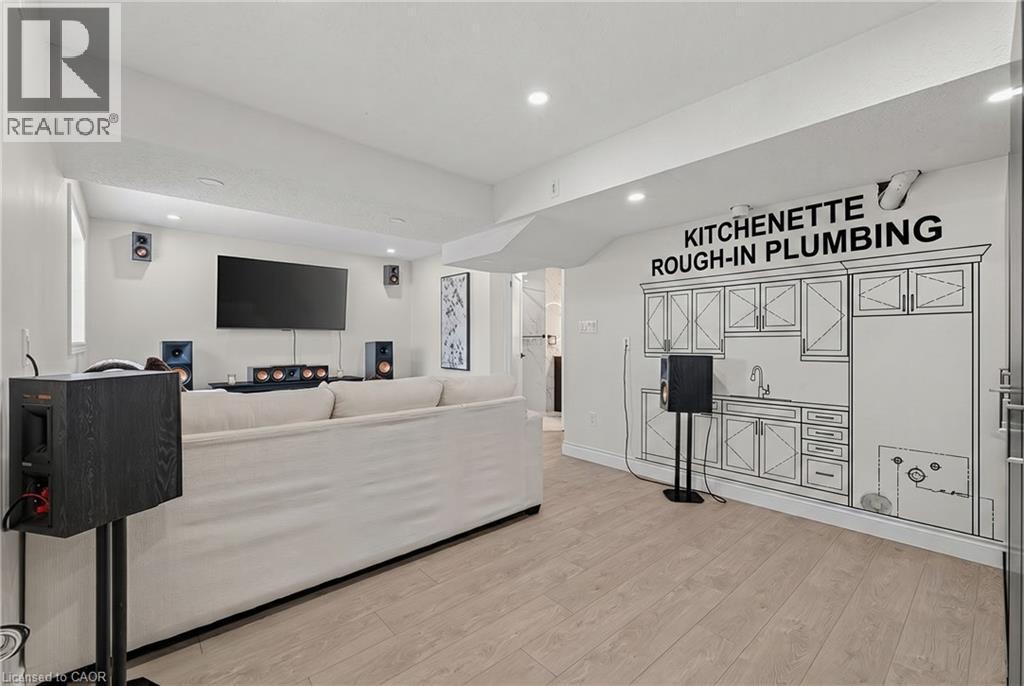 Recreation room featuring recessed lighting and wood-finish flooring - 79 Holbrook Crescent, Cambridge, ON - Indoor