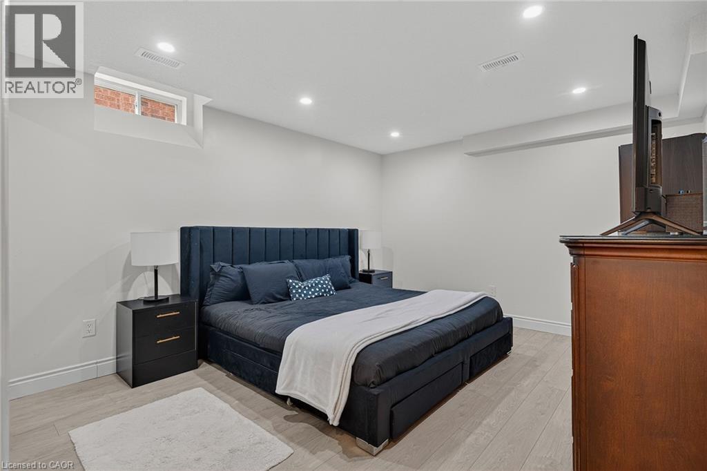 Bedroom featuring light wood-finish flooring and recessed ceiling lighting - 79 Holbrook Crescent, Cambridge, ON - Indoor Photo Showing Bedroom