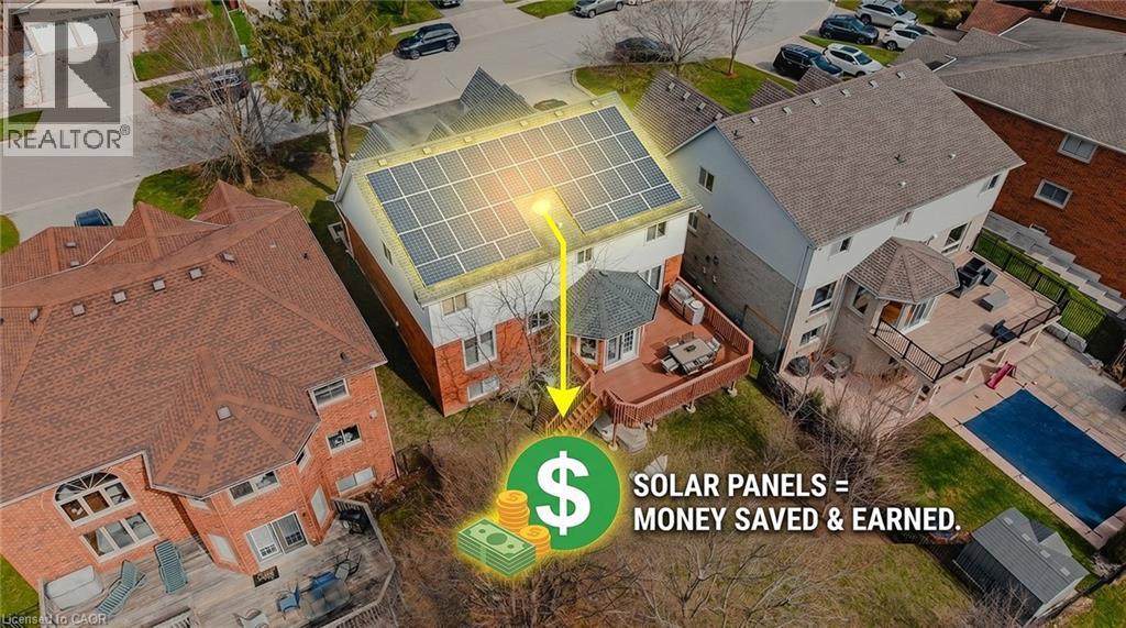 Two-story residence featuring a full array of rooftop solar panels - 79 Holbrook Crescent, Cambridge, ON -