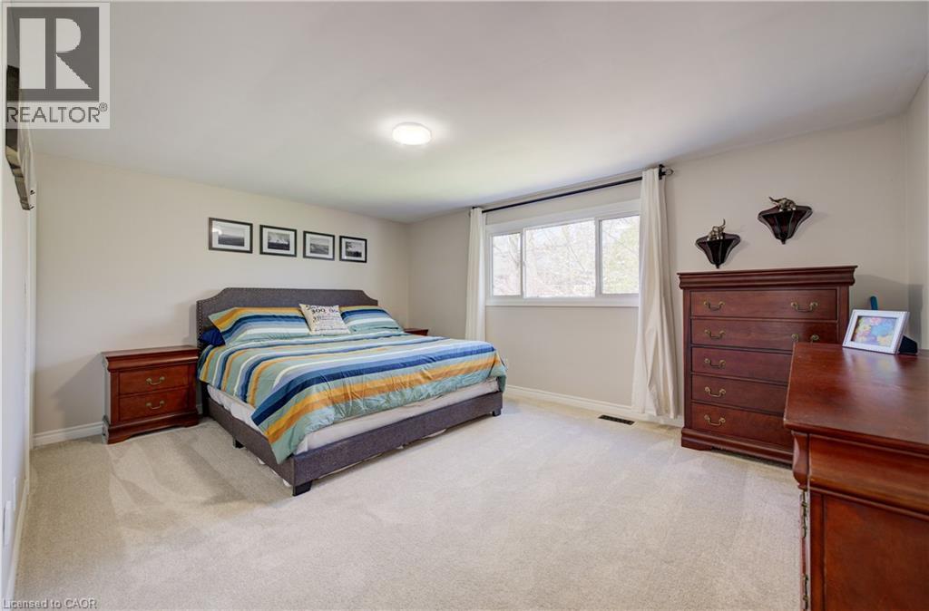 Spacious room featuring light-toned walls and neutral carpeting - 172 Rennie Drive, Kitchener, ON - Indoor Photo Showing Bedroom
