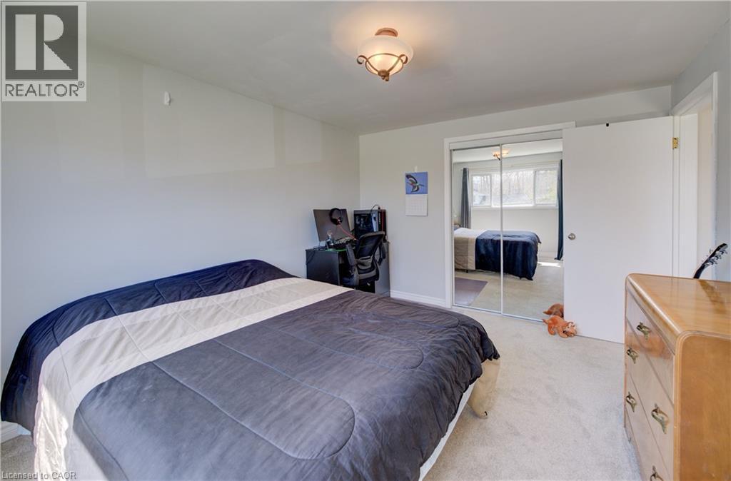 Bedroom featuring light-colored carpeting and a ceiling-mounted light fixture - 172 Rennie Drive, Kitchener, ON - Indoor Photo Showing Bedroom
