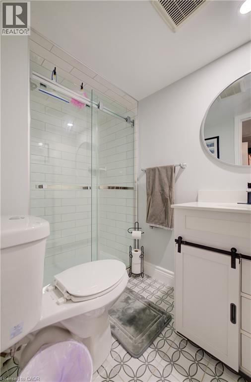 Shower featuring subway tile surround and clear glass sliding door - 172 Rennie Drive, Kitchener, ON - Indoor Photo Showing Bathroom