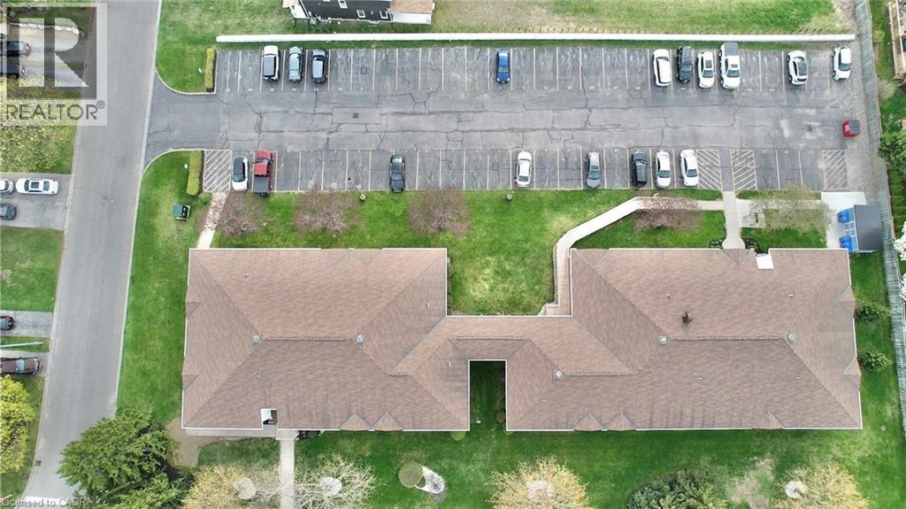 Parking lot - exclusive number parking spaces and visitor parking - 60 Donly Drive S Unit# 101, Simcoe, ON -