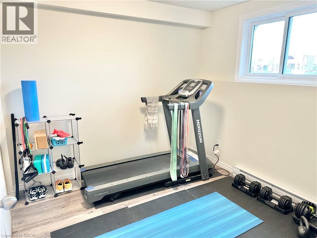 Bedroom - currently used as a work out room - 60 Donly Drive S Unit# 101, Simcoe, ON - Indoor Photo Showing Gym Room
