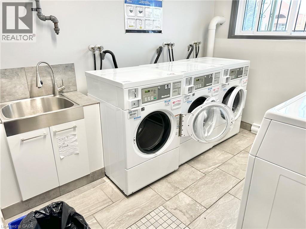 Couple doors down the hall is the Laundry Room - 60 Donly Drive S Unit# 101, Simcoe, ON - Indoor Photo Showing Laundry Room