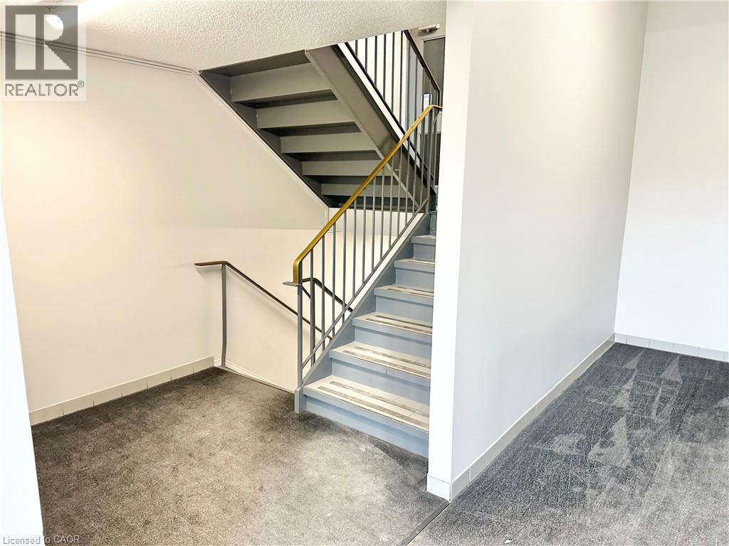 Staircase to in the Lobby to go to main level - 60 Donly Drive S Unit# 101, Simcoe, ON - Indoor Photo Showing Other Room
