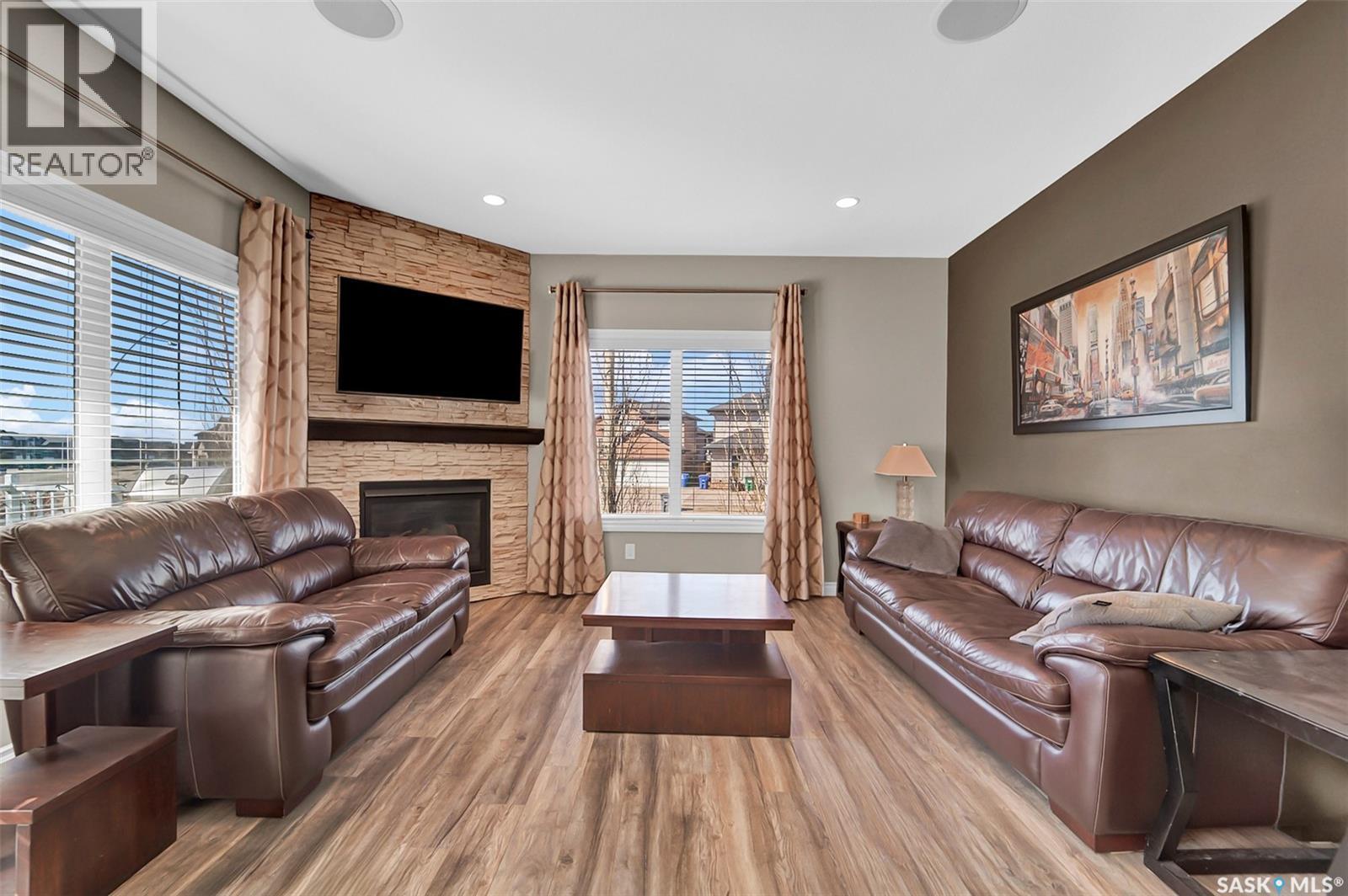 102 Atton Crescent, Saskatoon, SK - Indoor Photo Showing Living Room With Fireplace