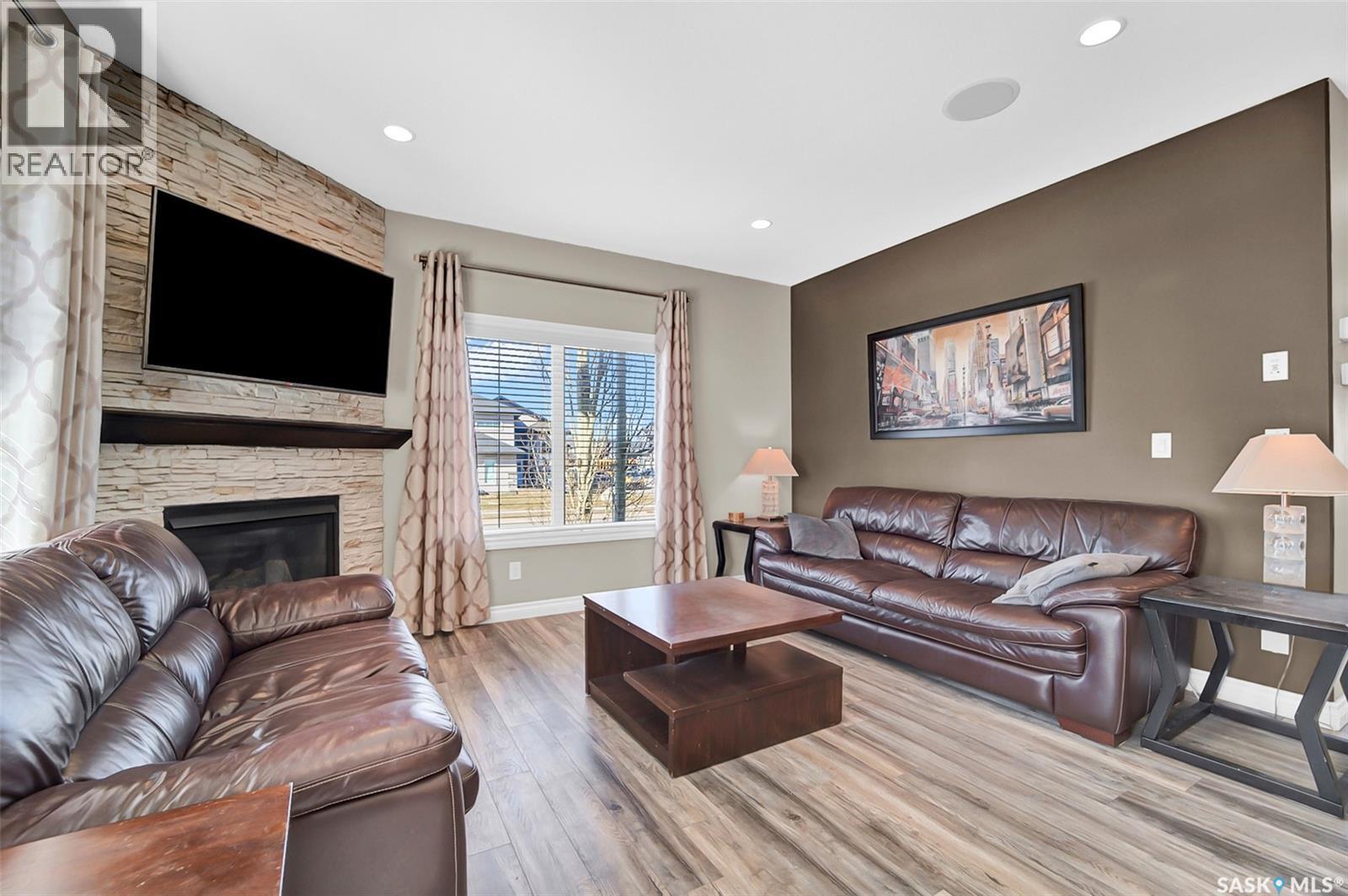 102 Atton Crescent, Saskatoon, SK - Indoor Photo Showing Living Room With Fireplace