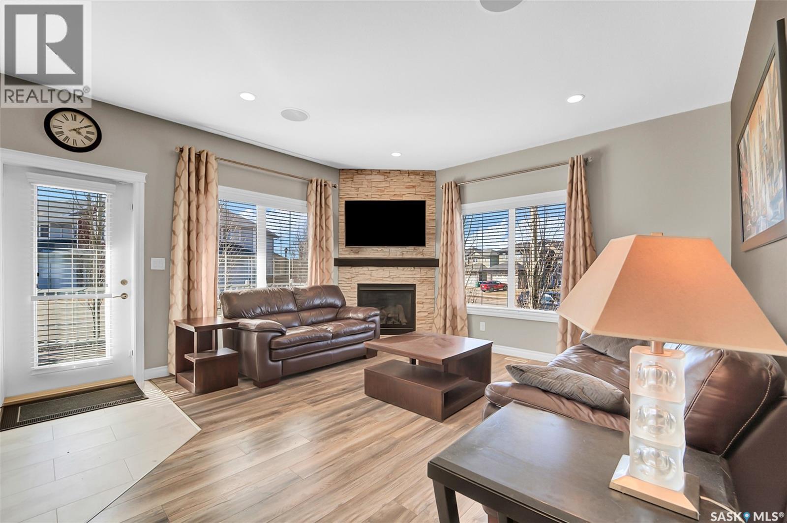 102 Atton Crescent, Saskatoon, SK - Indoor Photo Showing Living Room With Fireplace