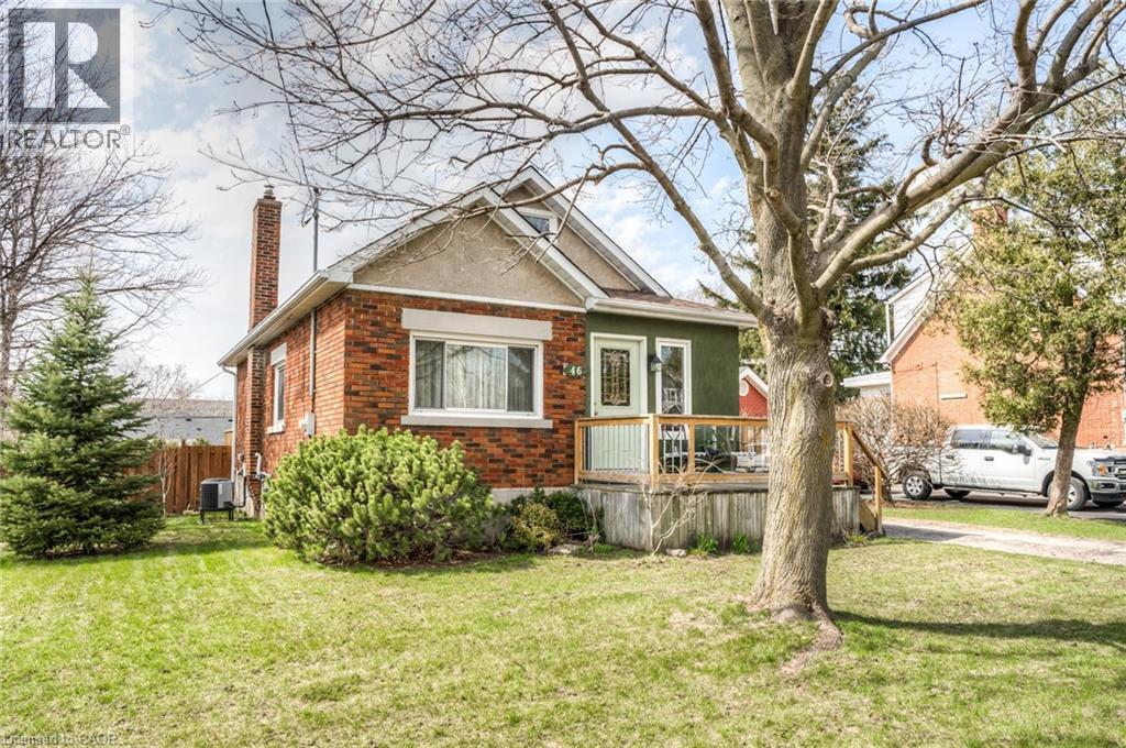 Brick and stucco exterior with a prominent front porch and a gabled roofline - 46 2 Avenue, Kitchener, ON - Outdoor