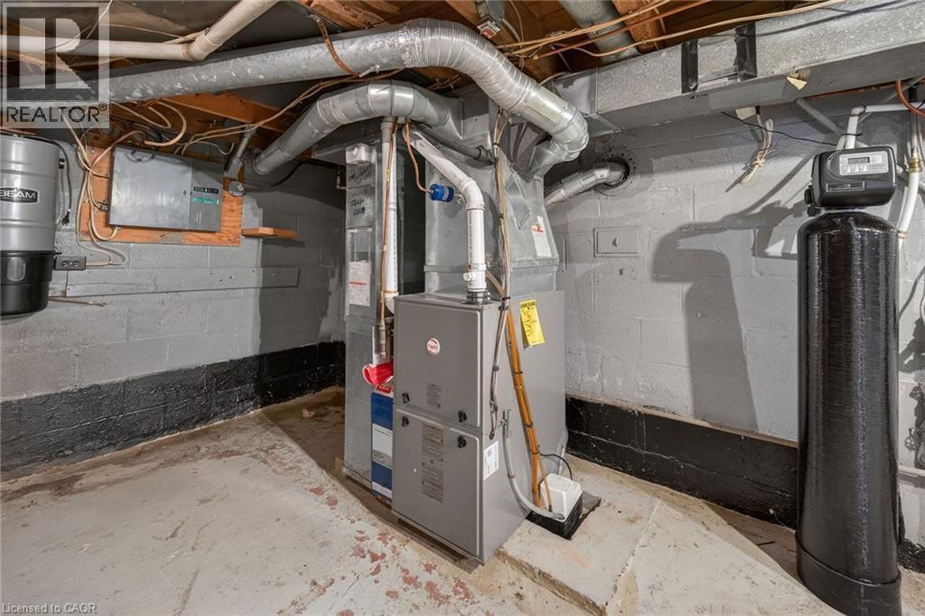 Mechanical room featuring a furnace, water softener, and central vacuum system - 192 Ivon Avenue, Hamilton, ON - Indoor Photo Showing Basement