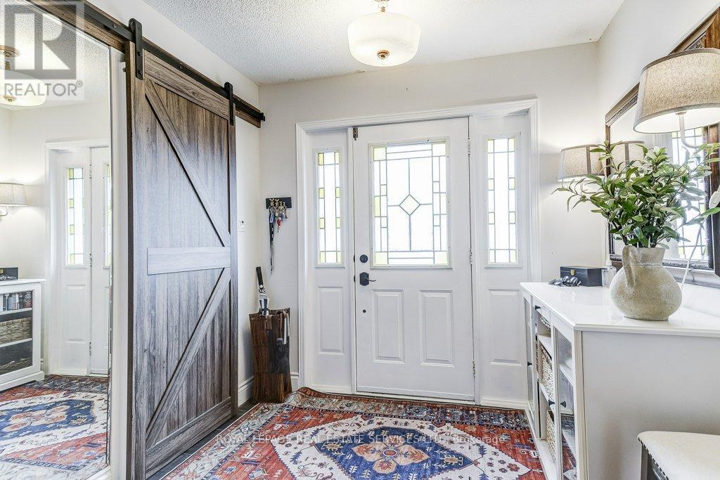 Ample Foyer with Barn door - 1279 Old English Lane, Oakville, ON - Indoor Photo Showing Other Room