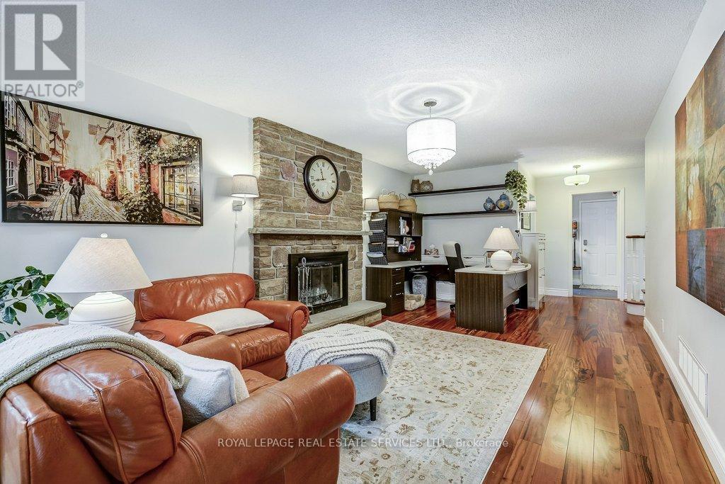 Cherry Hardwood floors - 1279 Old English Lane, Oakville, ON - Indoor Photo Showing Living Room With Fireplace