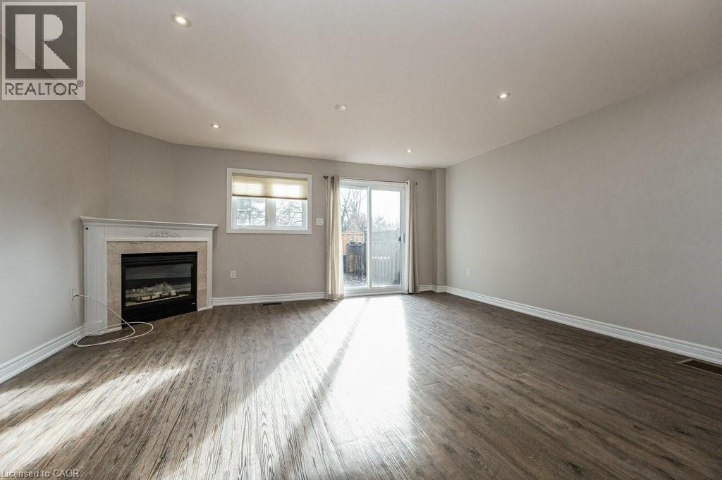 3542 Fowler Court, Burlington, ON - Indoor Photo Showing Living Room With Fireplace