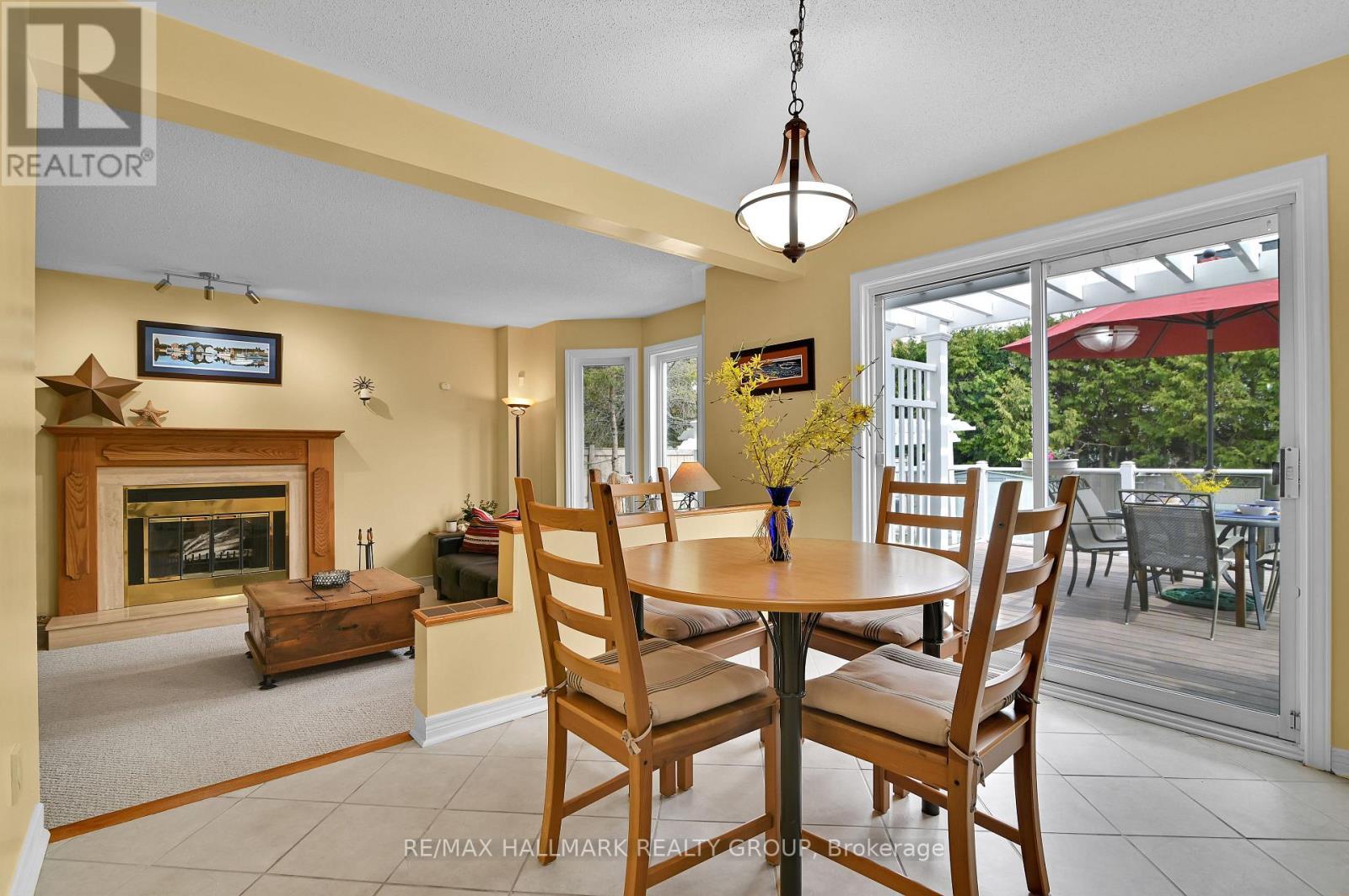 Main Level - Breakfast area - 21 Hime Crescent, Ottawa, ON - Indoor Photo Showing Dining Room With Fireplace