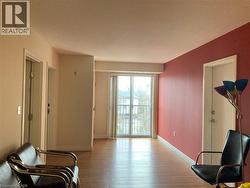 Light wood-finish flooring extending throughout the space -