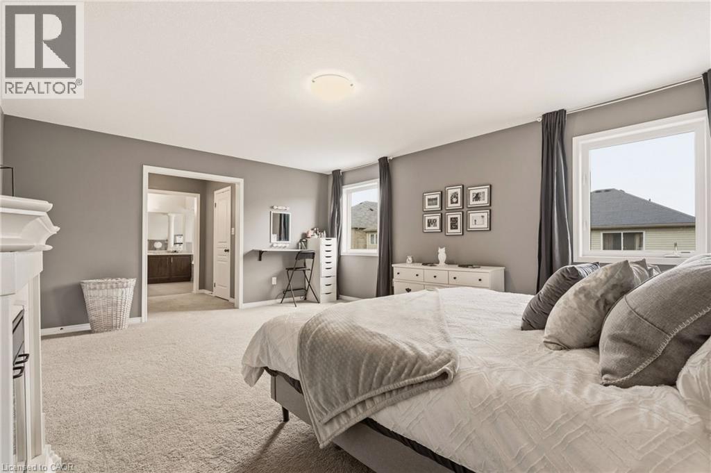 Carpeted bedroom featuring neutral gray walls and white trim - 42 Yager Drive, Binbrook, ON - Indoor Photo Showing Bedroom