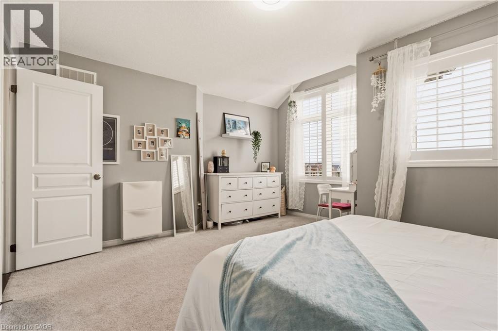 Spacious room featuring light gray walls and plush carpet flooring - 42 Yager Drive, Binbrook, ON - Indoor Photo Showing Bedroom