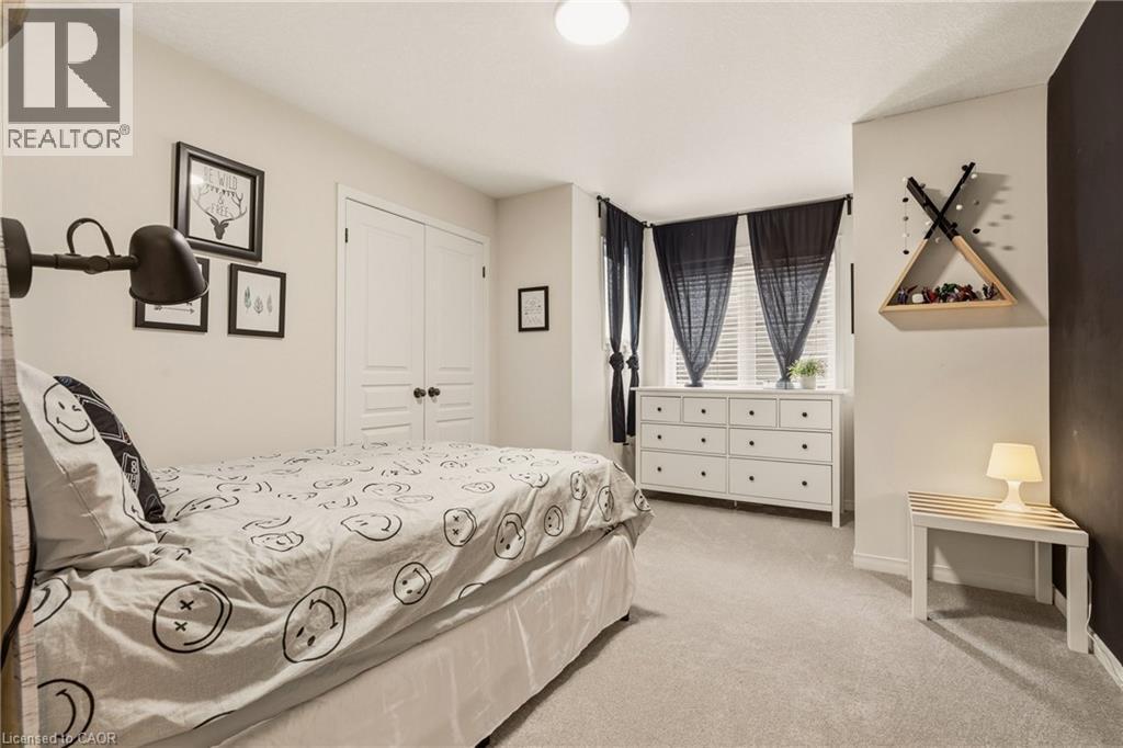 Bright room featuring light-colored carpeting and a window with blinds - 42 Yager Drive, Binbrook, ON - Indoor Photo Showing Bedroom